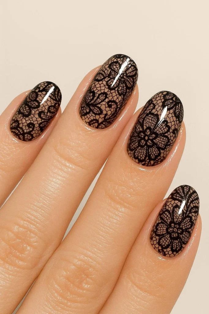 High-shine glossy lace nail art with luminous intricate lace detail 