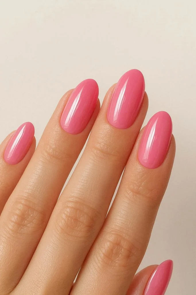 Glossy pink graduation nails with feminine high-shine finish