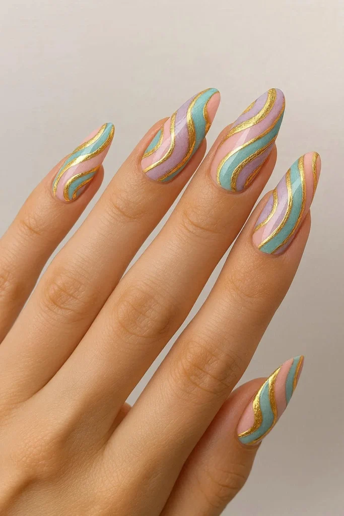 Gold accent pucci nails with luxe metallic details and swirl design