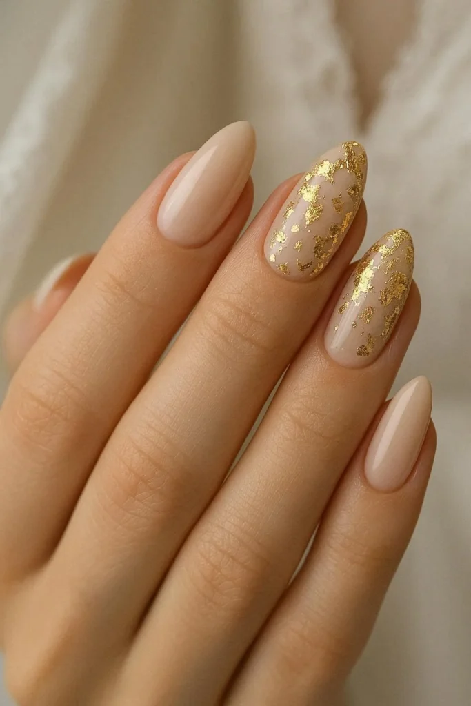 Gold foil accent engagement nails on ivory nude base 
