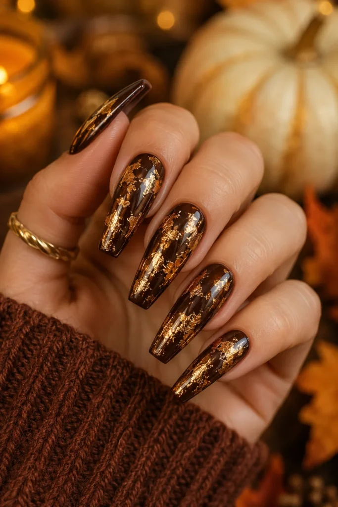 Gold foil coffin nails over dark base for fall Thanksgiving style