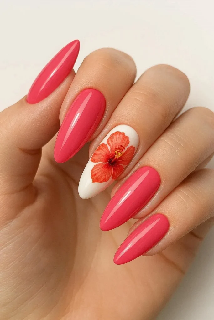Hibiscus flower almond nails with bold tropical blooms on pastel base