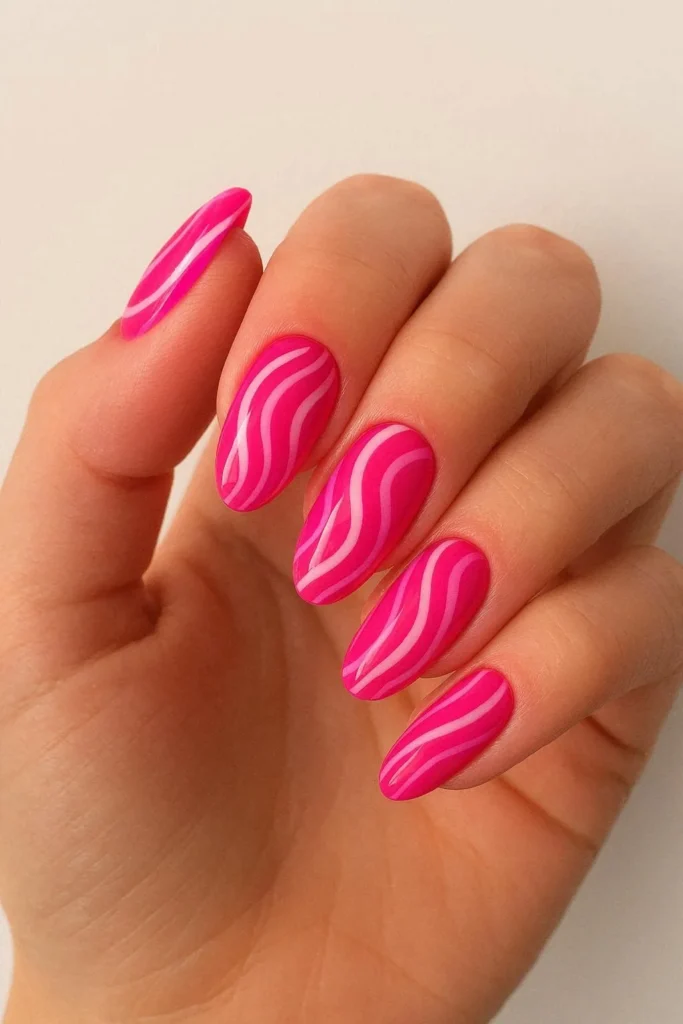 Hot pink swirl nails with vibrant retro fuchsia abstract design