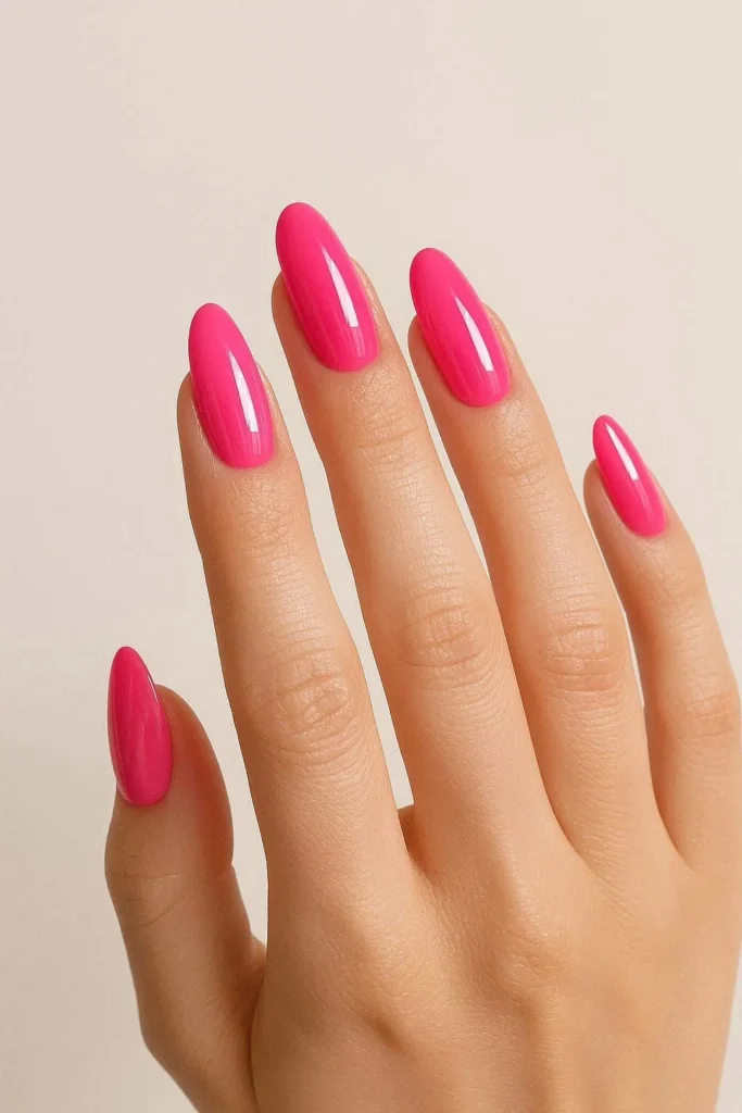 Vibrant hot pink glossy Y2K nail design 