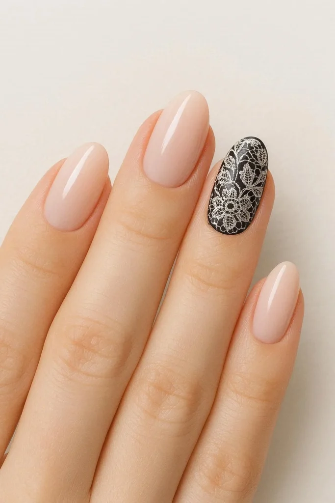 Elegant lace accent nail art with detailed intricate nail design