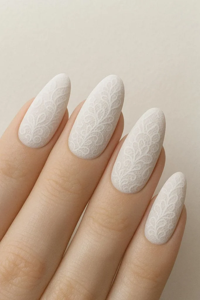 Velvety matte finish nails with fine intricate lace patterns 