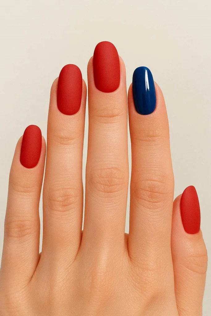Bold matte red holiday nails with modern velvet finish