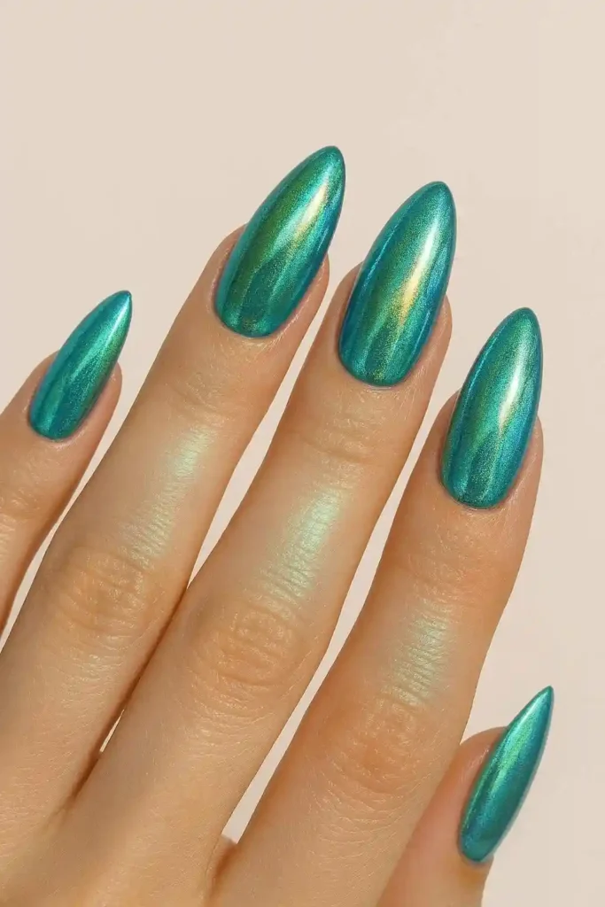 Mermaid chrome nails with teal and gold iridescent finish