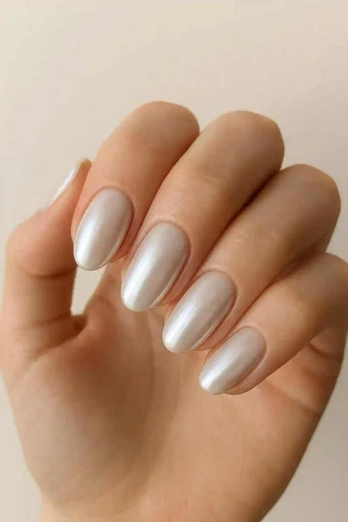 Milky white chrome nails with pearlescent iridescent finish