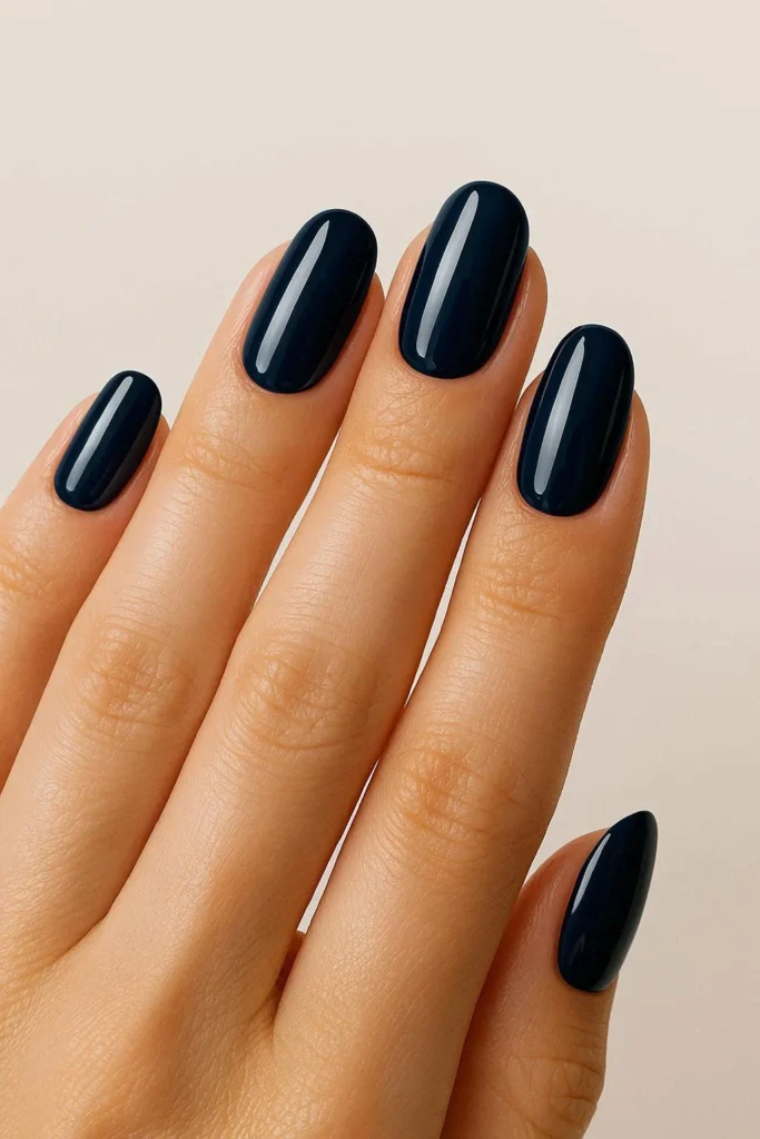 Deep glossy navy blue nails for patriotic holiday look 