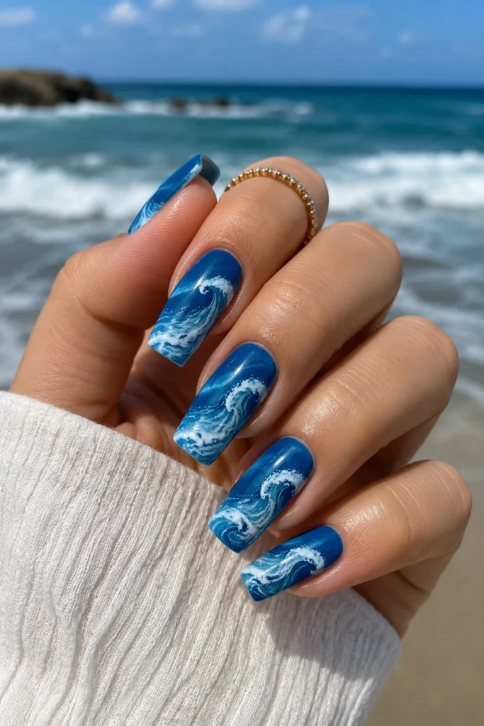 Ocean blue wave nails with white swirl detail summer 
