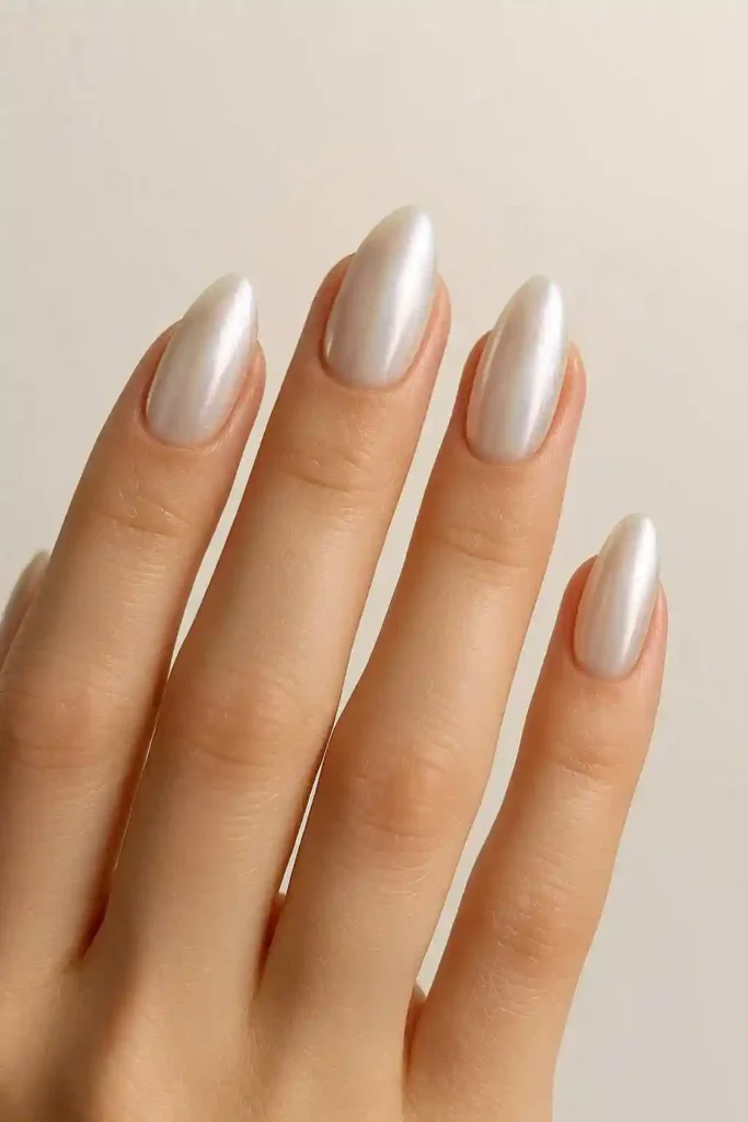 Pearl chrome almond nails with iridescent pearlescent finish