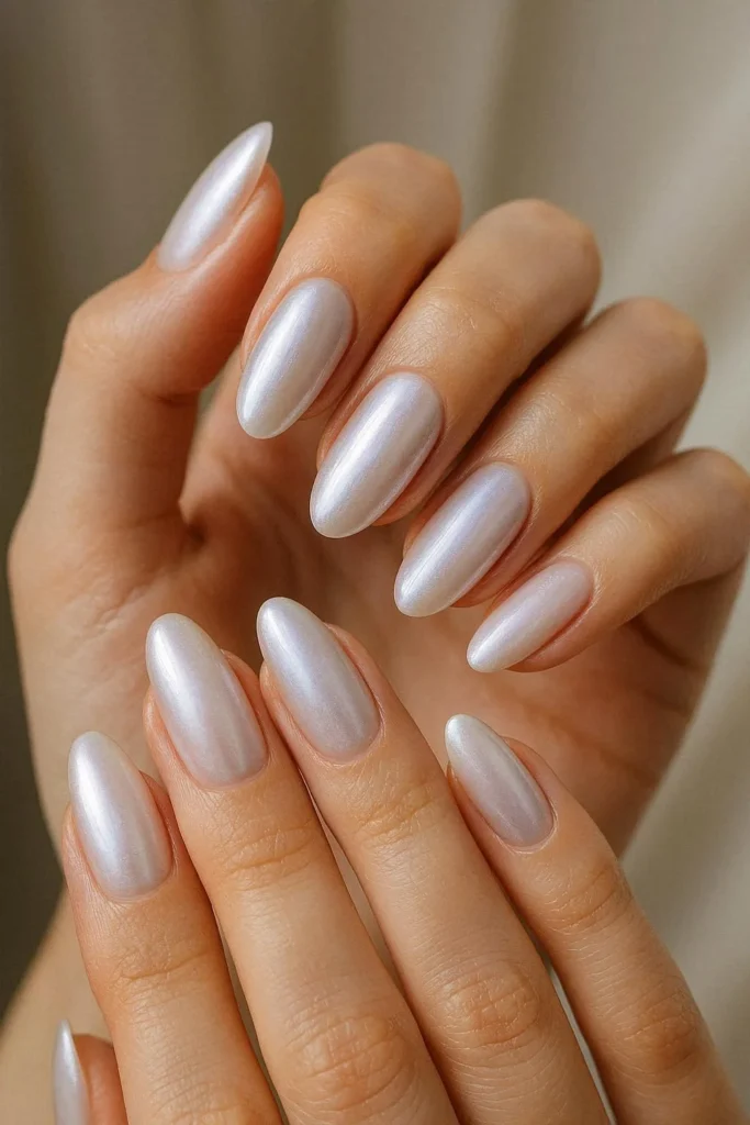 Pearl chrome shimmer engagement nails soft iridescent glow 

