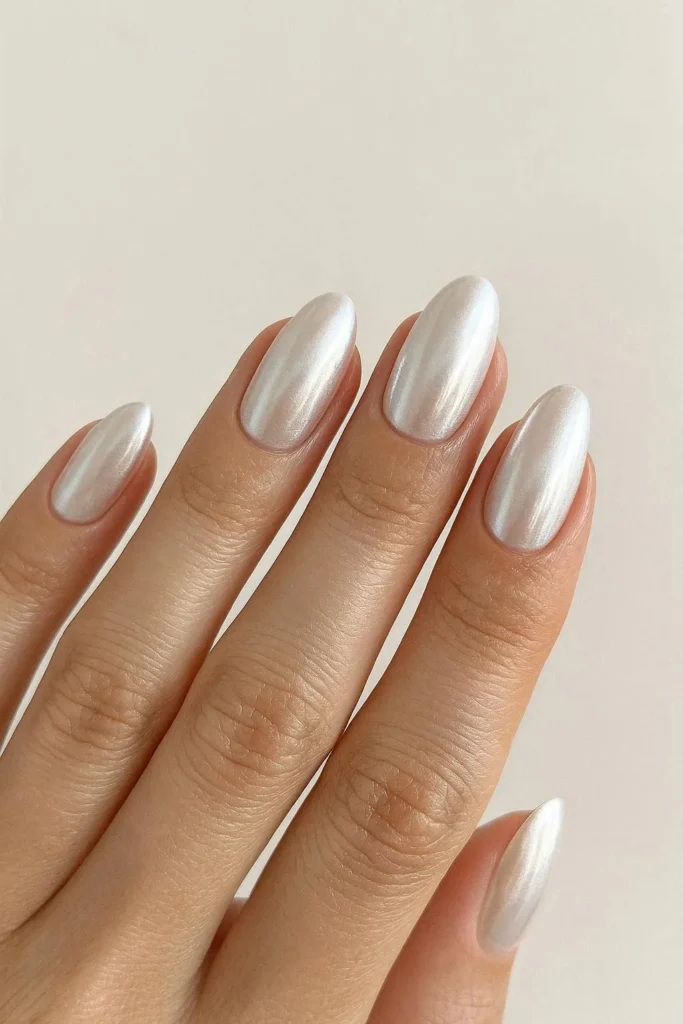 Soft pearlescent pearl chrome nails for luxe winter look 