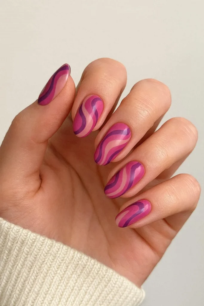Pink purple swirl nails with feminine retro abstract tones