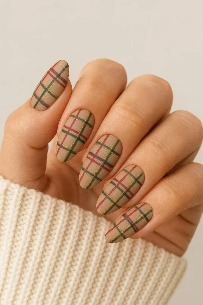 Plaid sweater pattern nail art in red green and gold