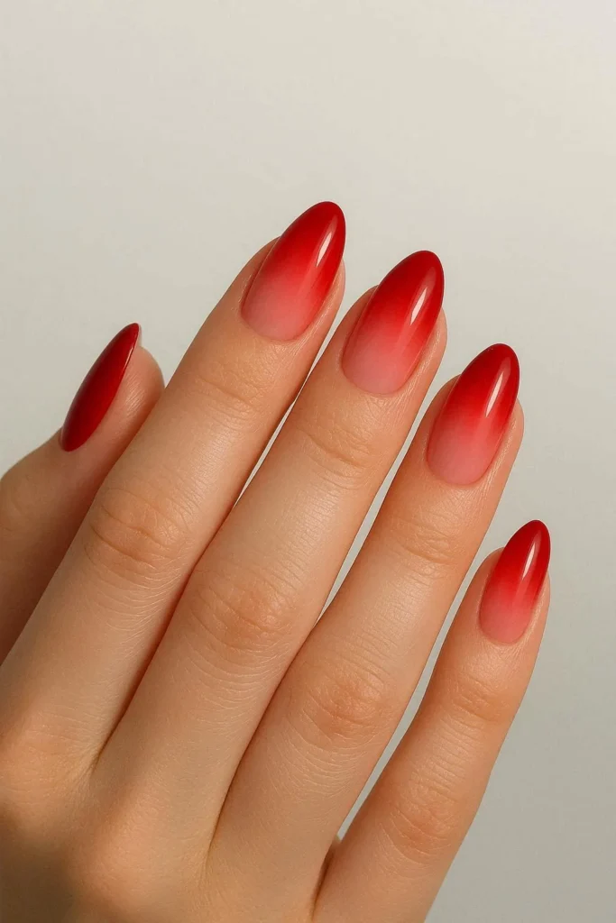 Red ombre nails with gradient red to blush summer finish