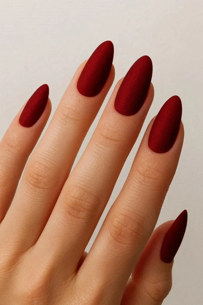 Red velvet matte almond nails for elegant Christmas manicure