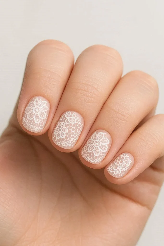 Delicate lace nail art on short nails with simple elegant designs