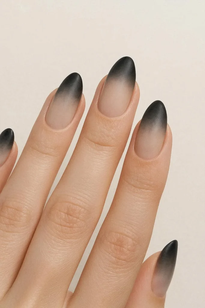 Smoky ombre black French nails gradient fade design