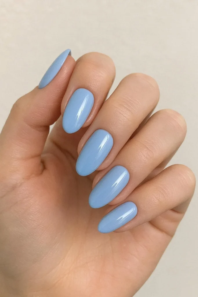 Soft blue graduation nails with pastel glossy elegant finish