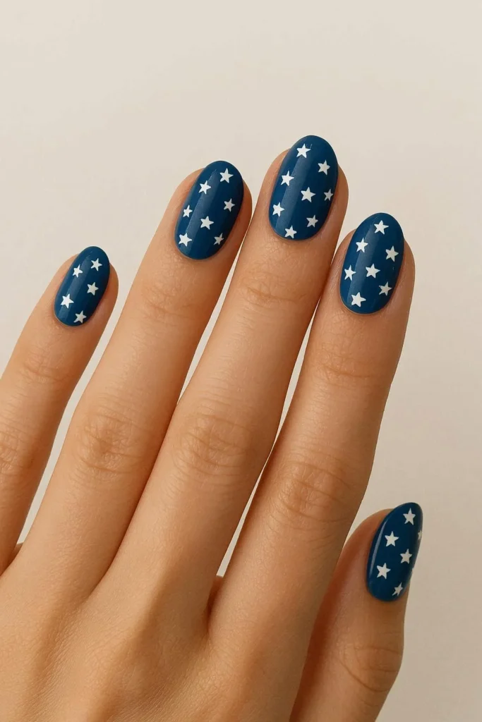 Star accent nails with white stars on blue base