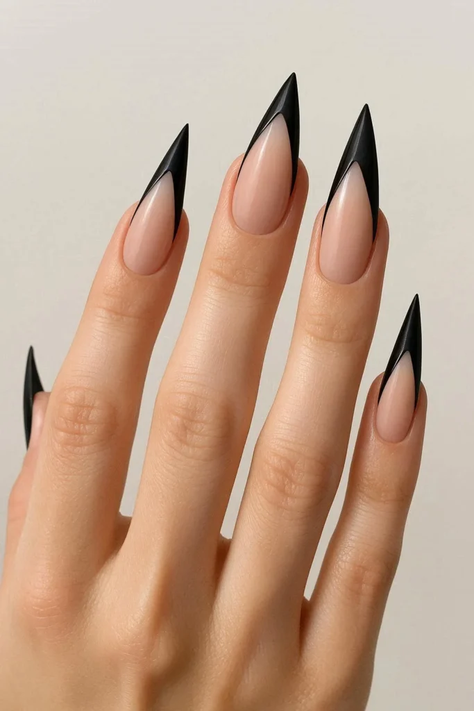 Stiletto shaped black French manicure bold pointed tip