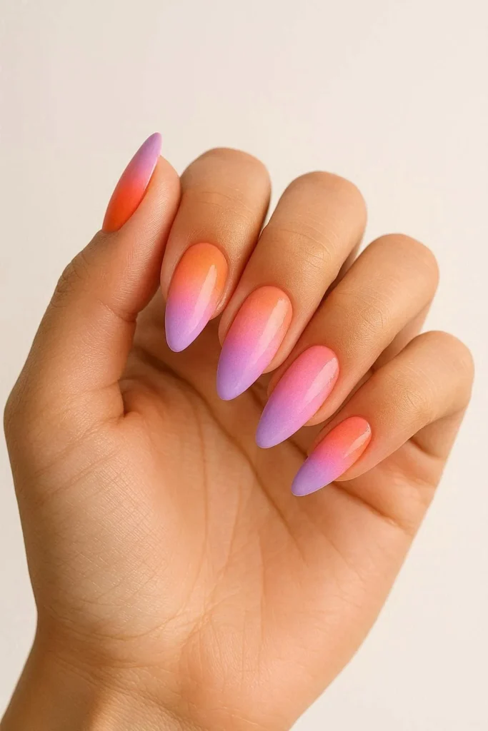  Sunset ombre almond nails blending orange pink and purple tones