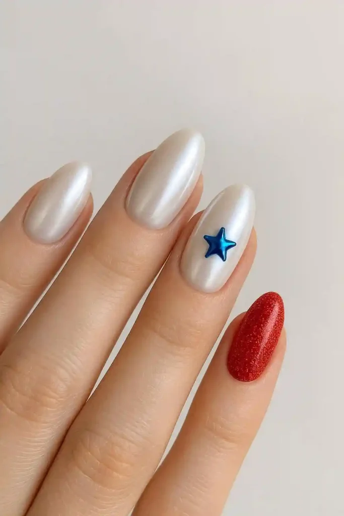 Pearl white chrome nails paired with patriotic festive accents