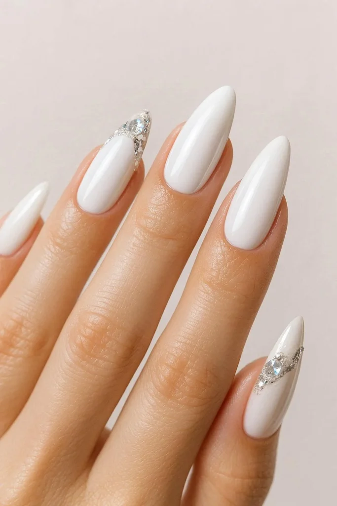 White glam baddie nails with shiny embellishments and crisp finish