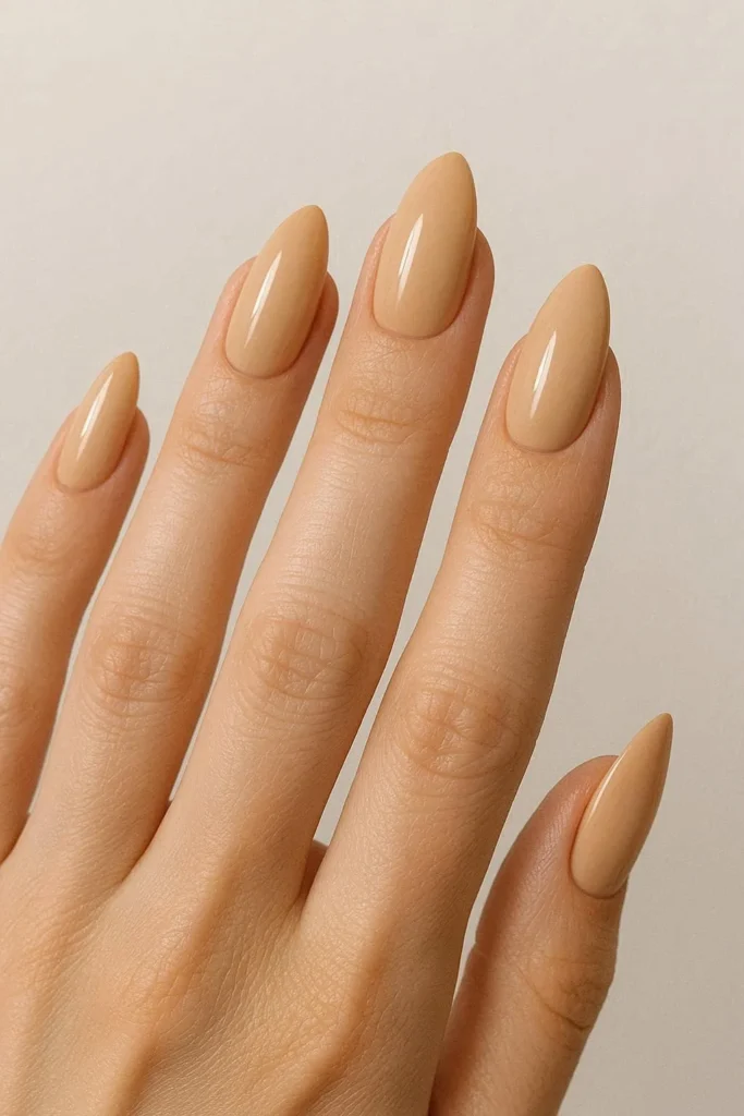 Elegant almond shaped nails in warm beige neutral shade