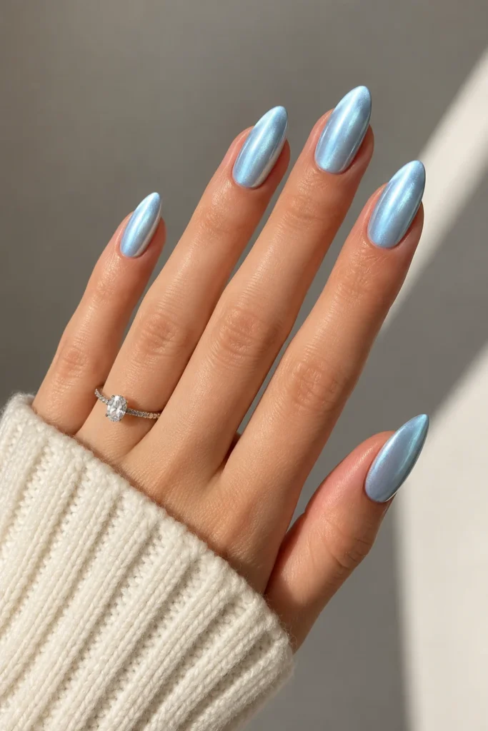 Elegant almond shaped nails in a frosted icy blue shade