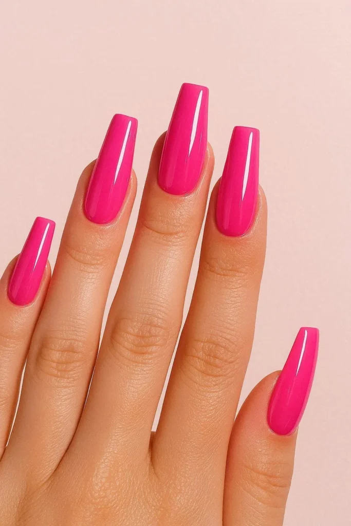 Barbiecore pink acrylic nails in bold fuchsia glossy finish