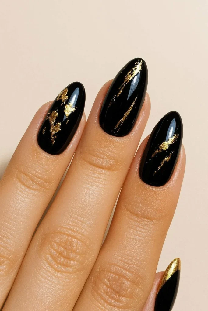 Black and gold glam nail design inspired by Bruno Mars style