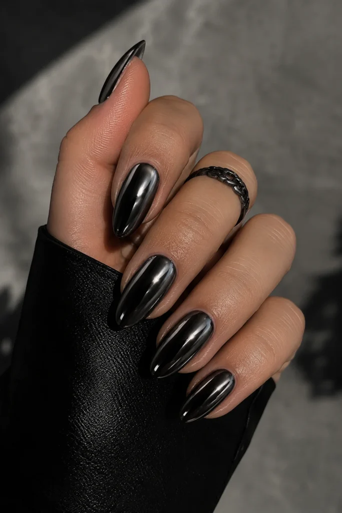 Black chrome almond nails dark reflective bold dramatic metallic finish