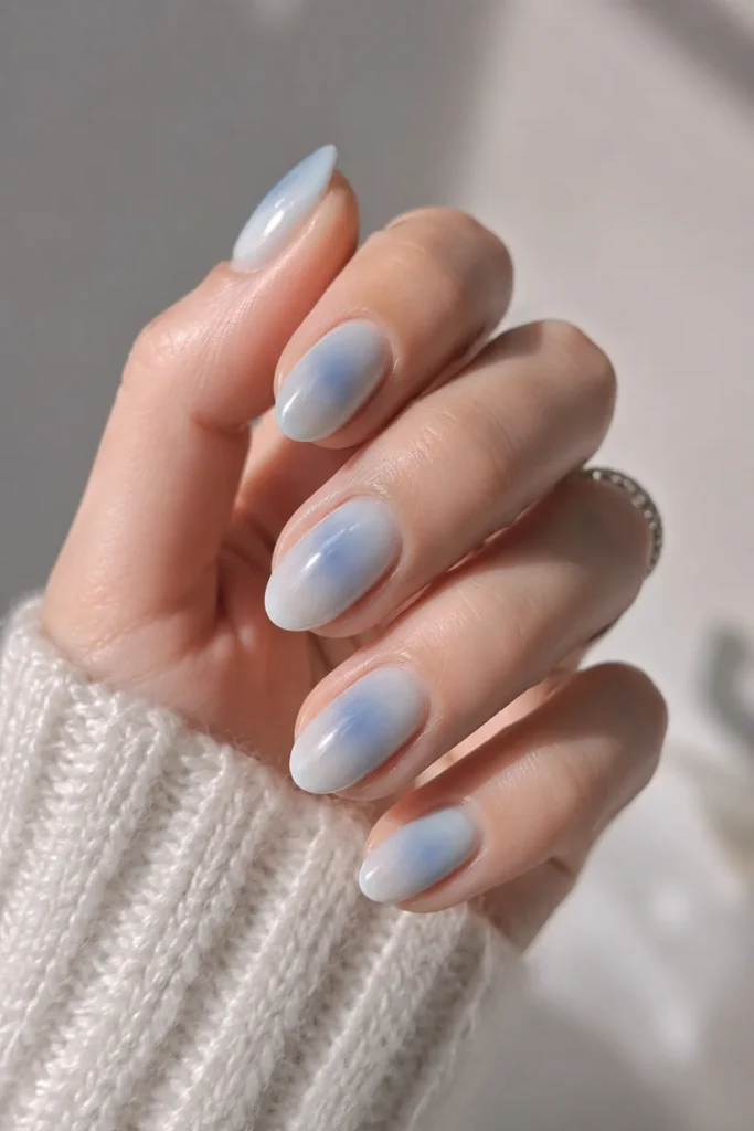 Soft cool-toned blue aura nails with dreamy blended edges