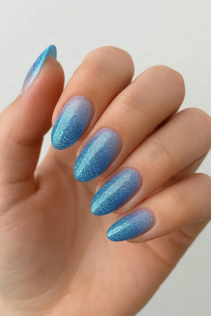 Blue glitter gradient nails with dreamy ombre finish
