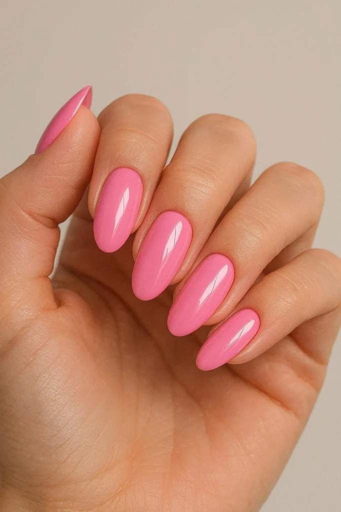 Bubblegum pink acrylic nails with playful high-gloss candy finish
