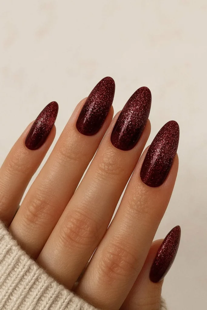 Burgundy glitter ombre nails with rich wine tones and sparkle