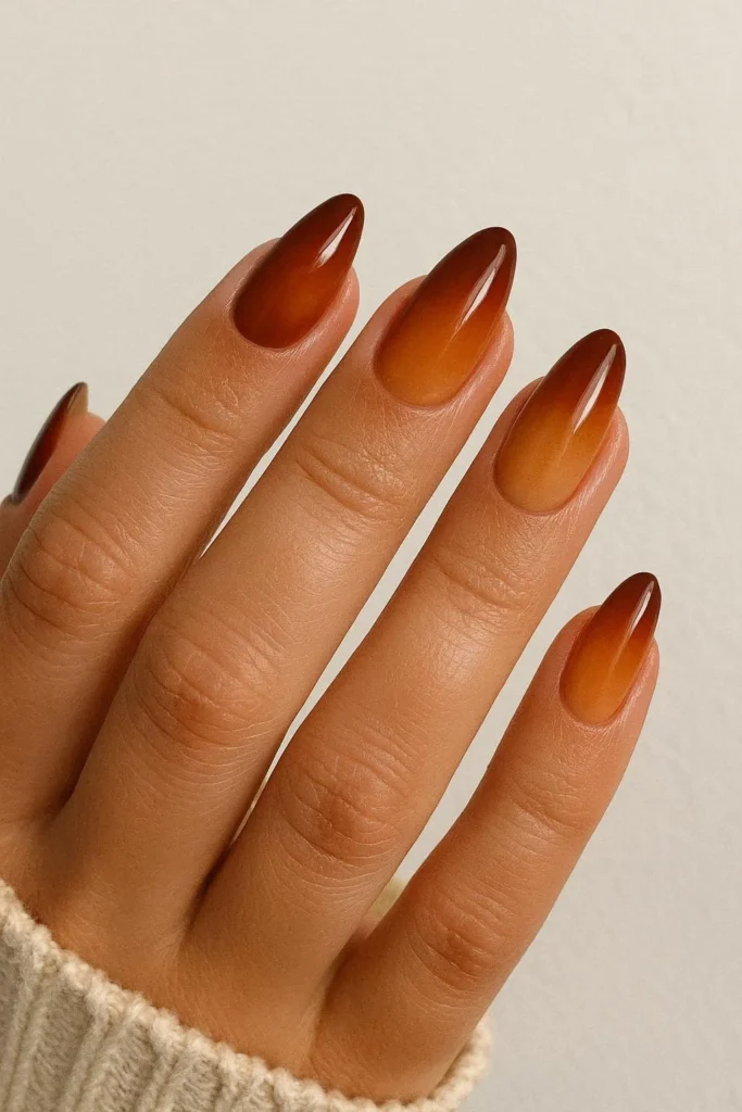 Burnt caramel ombre nails with swirl fall design