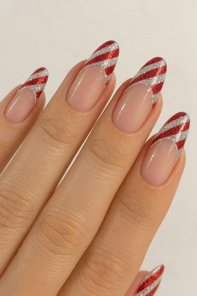 Sparkly glitter French tip nails with candy cane stripe details