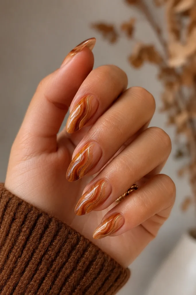 Caramel and cinnamon swirl nails warm autumn tones