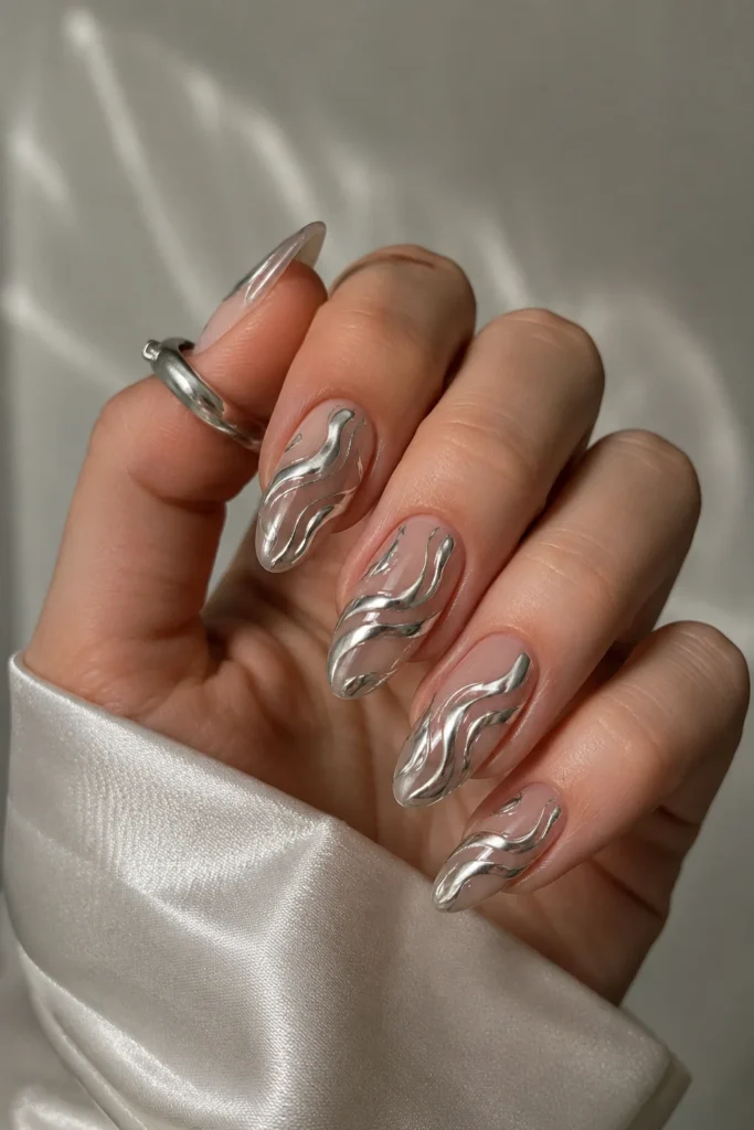 Chrome swirl almond nails abstract metallic design glossy neutral base