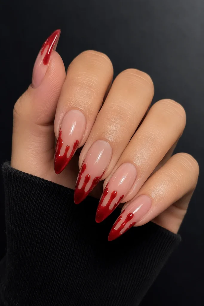 Classic red blood drip French tip nails on nude base