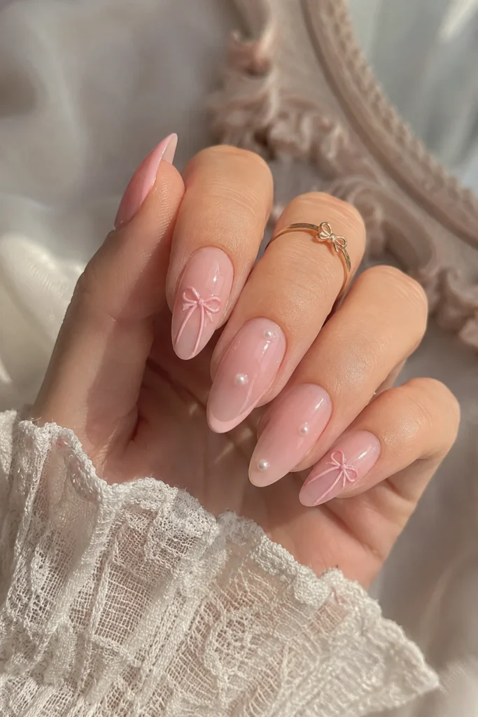 Soft pink coquette bow nails with ribbon details