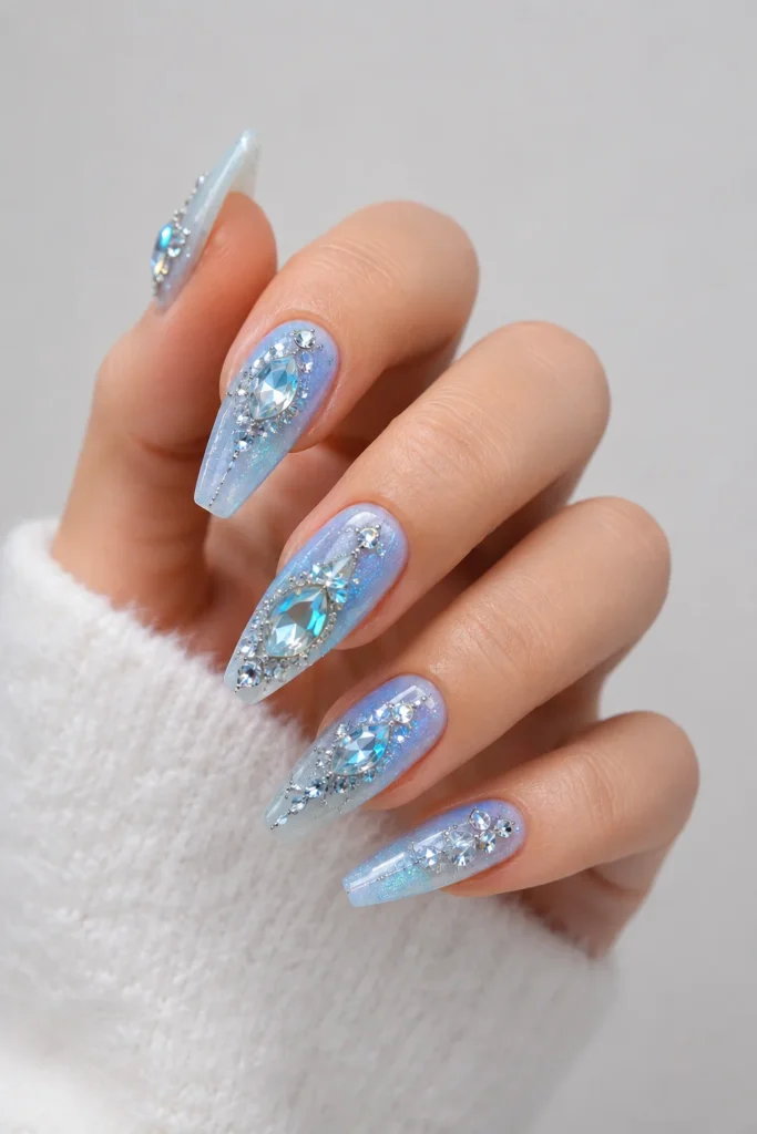 Crystal gem-inspired nail design with icy blue cool-toned shades