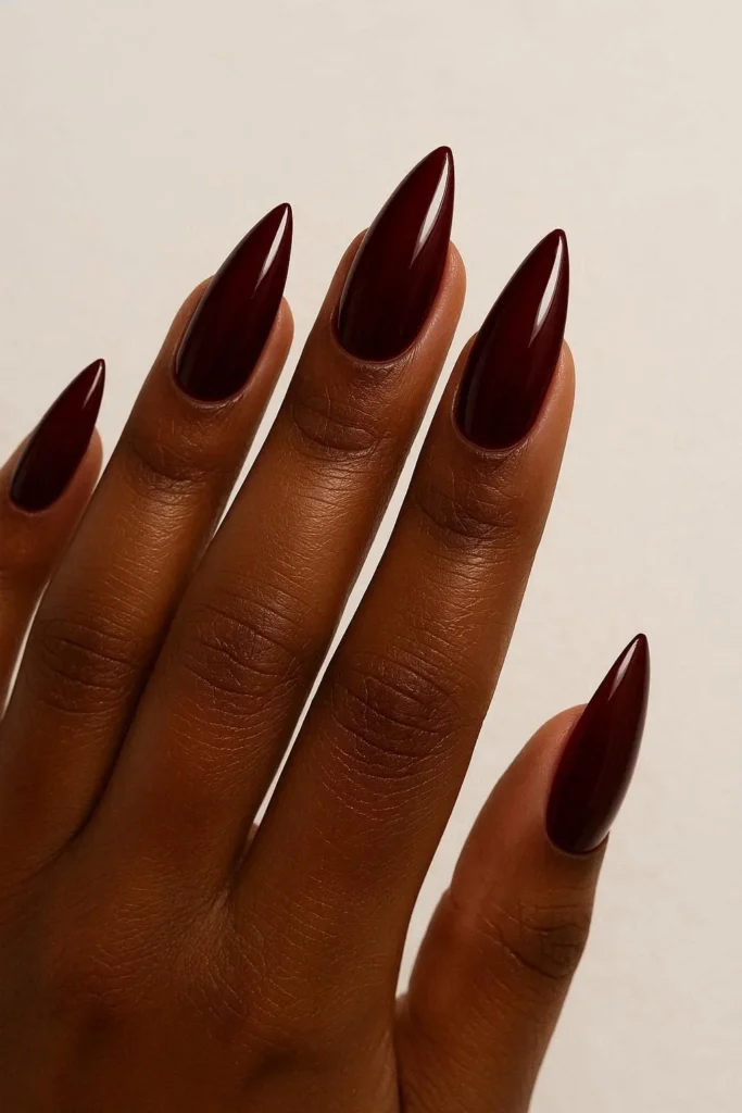 Dark red almond fall nails vampy look on brown skin