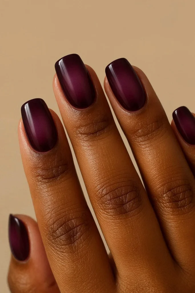 Deep plum aura diffused nails on rich dark skin tones