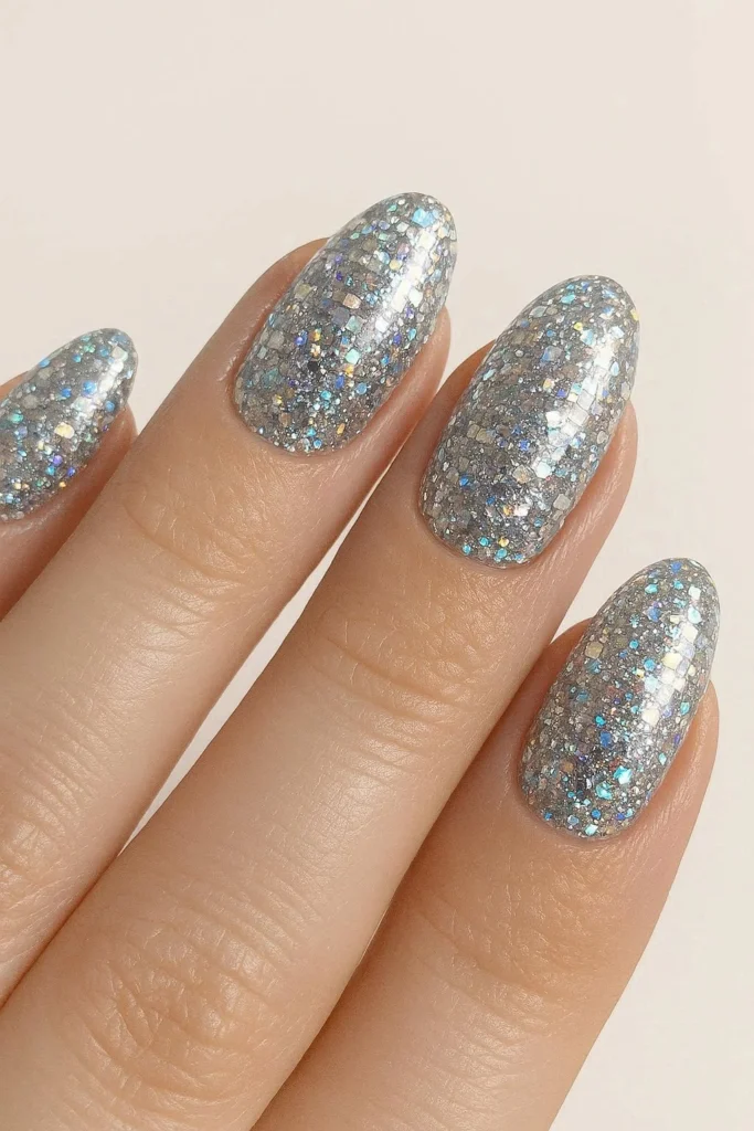 Silver disco ball glitter nails for a concert ready look