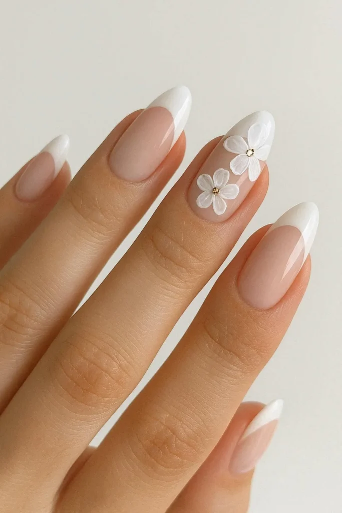 Elegant bridal French nails with white blossom nail art